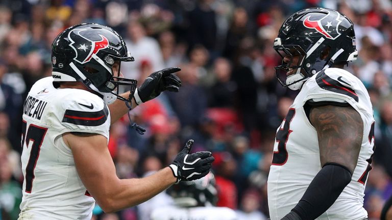 Houston Texans tight end Foster Moreau (87), second left celebrates after scoring the first touchdown during an NFL football game against Jacksonville Jaguars in London, Sunday, Oct. 18, 2026. (AP Photo/Ian Walton)