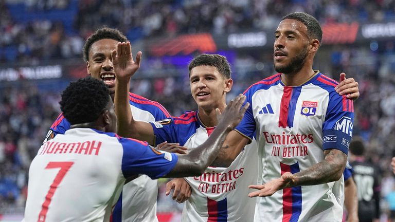 Lyon's Corentin Tolisso, second right, is congratulated by teammates after scoring the opening goal against Crystal Palace