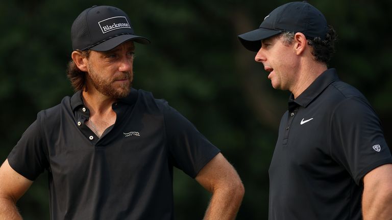Tommy Fleetwood and Rory McIlroy in discussion during round one at Delhi Golf Club