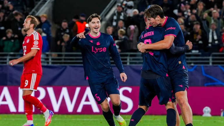 Viking celebrate their late equaliser against Bayern Munich as Harry Kane looks on