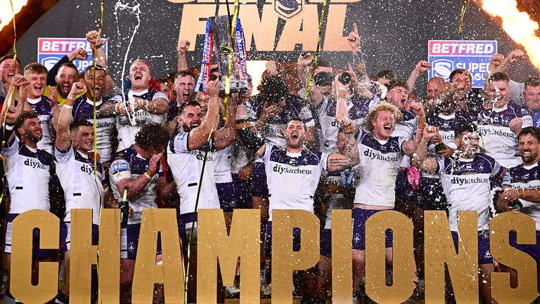 Wakefield celebrate with the Super League trophy