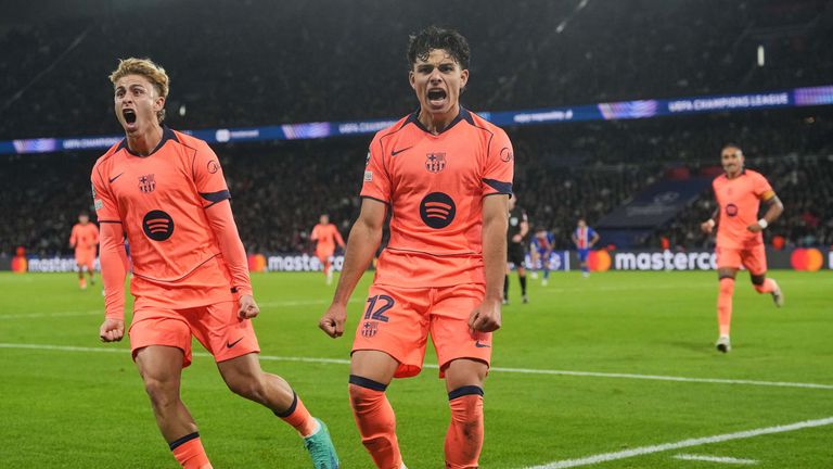 Barcelona's Xavi Espart, center, celebrates with his teammates after scoring his side's opening goal during the Champions League opening phase soccer match between Paris Saint-Germain and FC Barcelona in Paris, Tuesday, Oct. 20, 2026. (AP Photo/Thibault Camus)